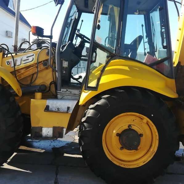 Экскаватор погрузчик New Holland 115