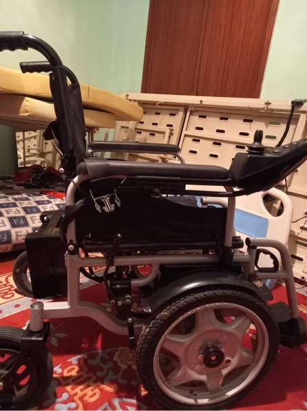Инвалидная коляска в 